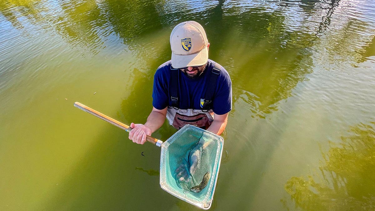 man holds fish