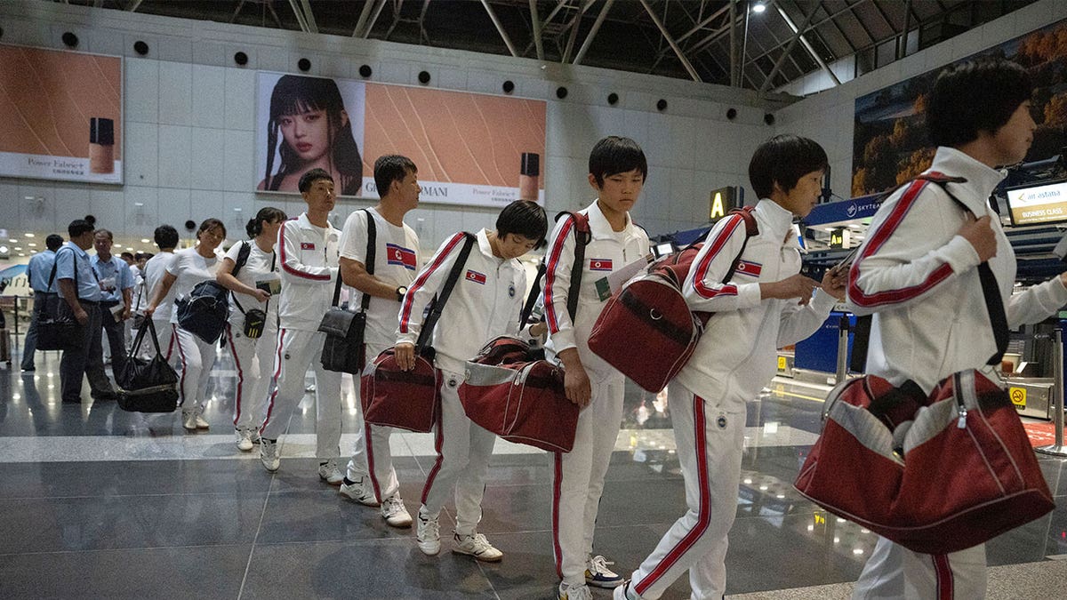 north koreans wear tracksuits