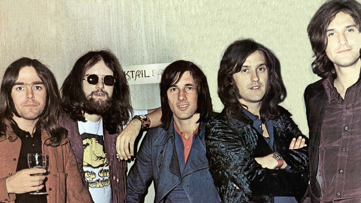 John Gosling poses with The Kinks in 1970