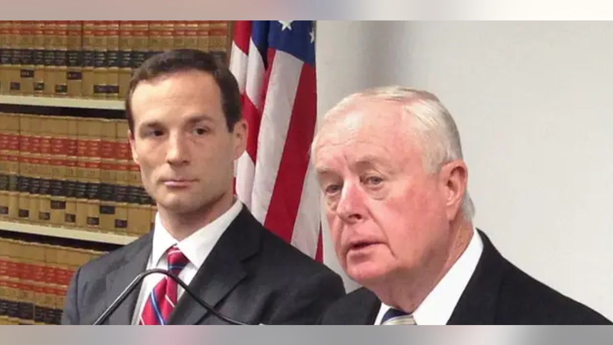Former Suffolk County District Attorney Tom Spota (right), pictured here during a 2015 press conference announcing rape charges against three MS-13 gang members, was convicted as part of the scandal to protect Police Chief James Burke
