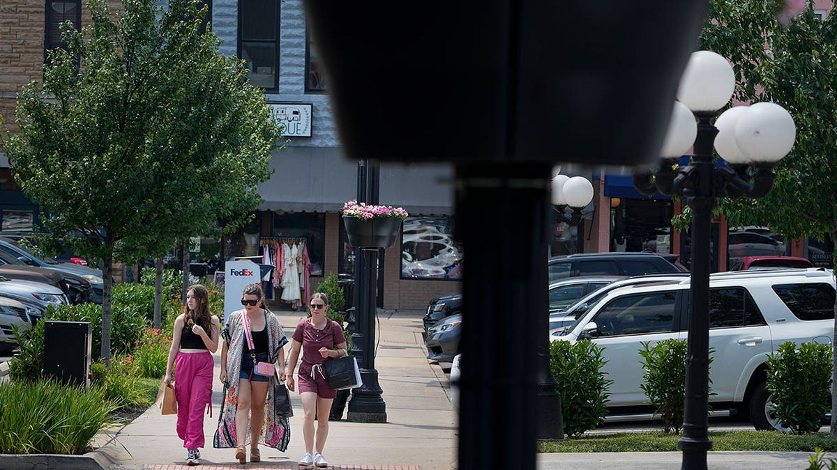 People walk through Tennessee town square