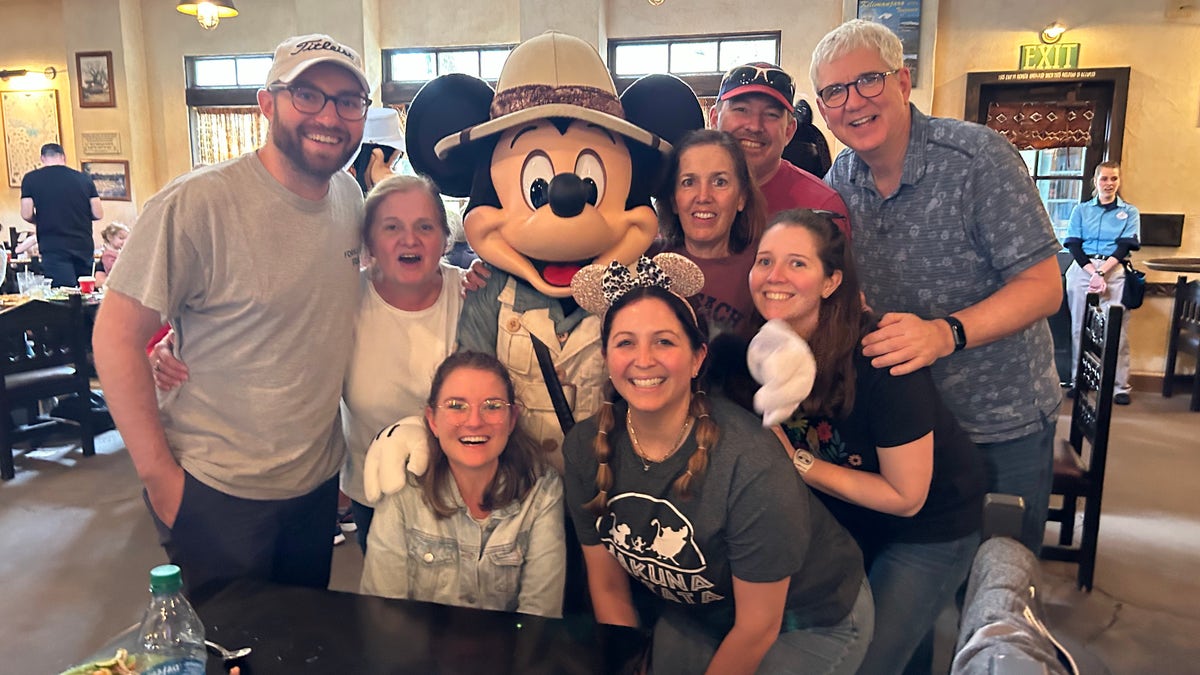 Sandy Caterine with family at Disney