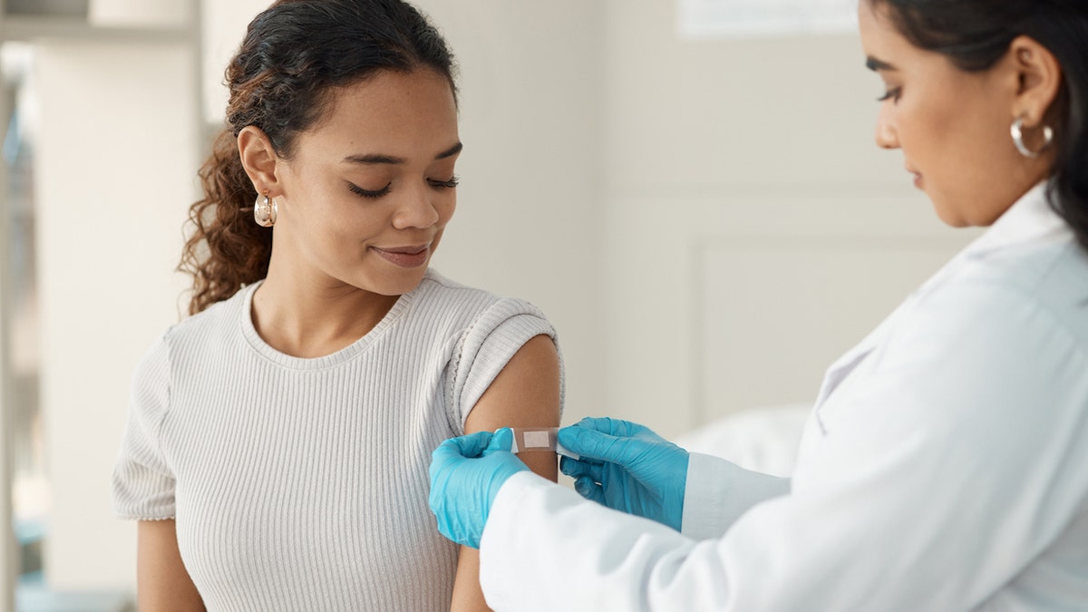 Woman getting vaccine