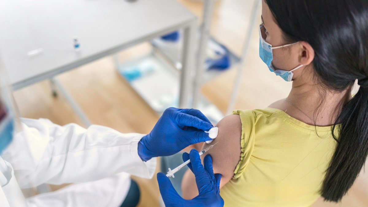 Woman getting vaccine