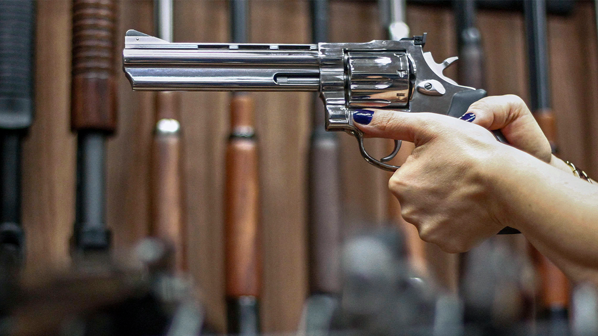 Woman holding revolver