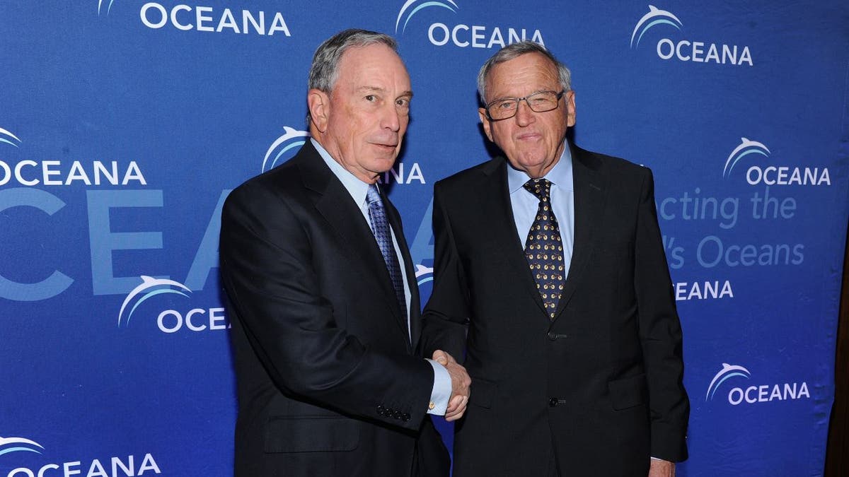 Hansjörg Wyss, right, shaking hands with Michael Bloomberg