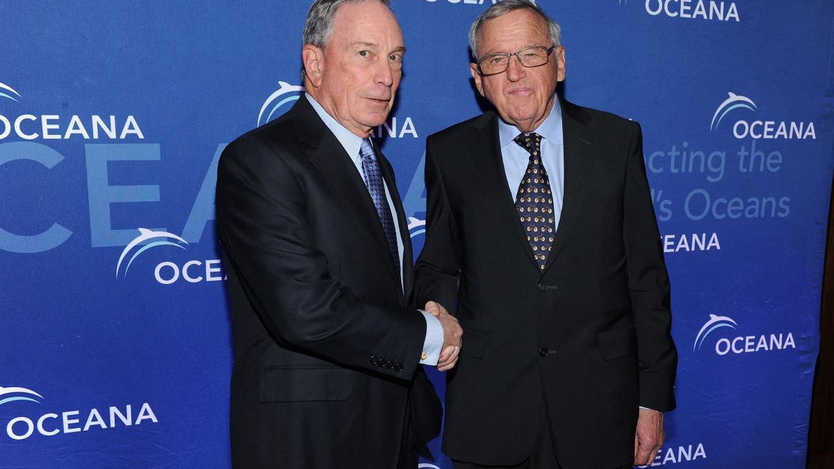 Hansjörg Wyss, right, shaking hands with Michael Bloomberg