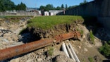 A sewer pipe is exposed due to eroded land in Vermont