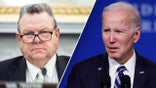 Sen. Jon Tester, D-Mont., and President Joe Biden.