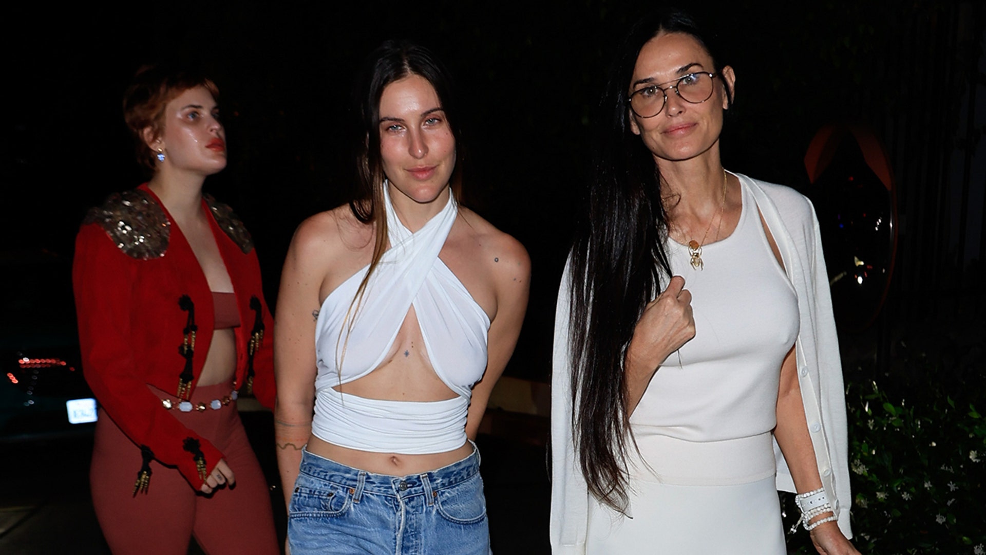 Demi Moore and her daughters walking outside