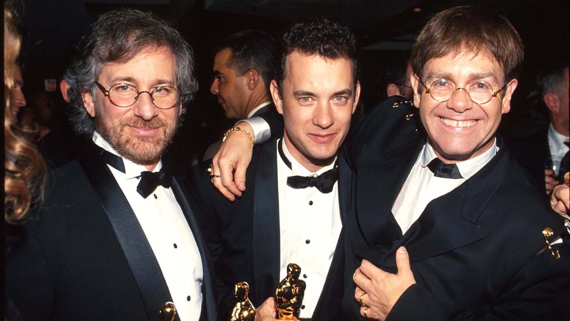 Steven Spielberg, Tom Hanks, and Elton John pose for a photo