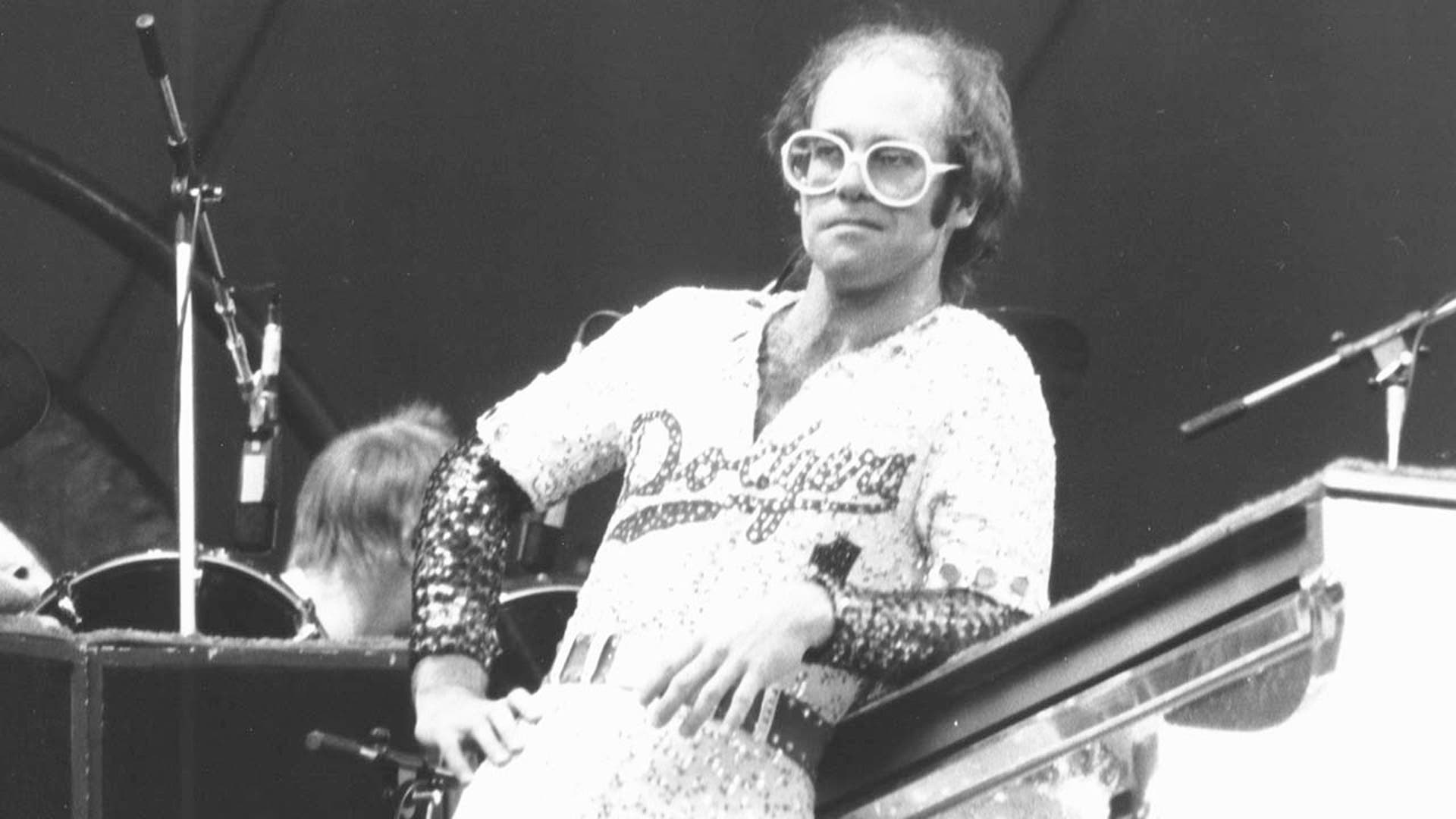 Elton John performs on stage