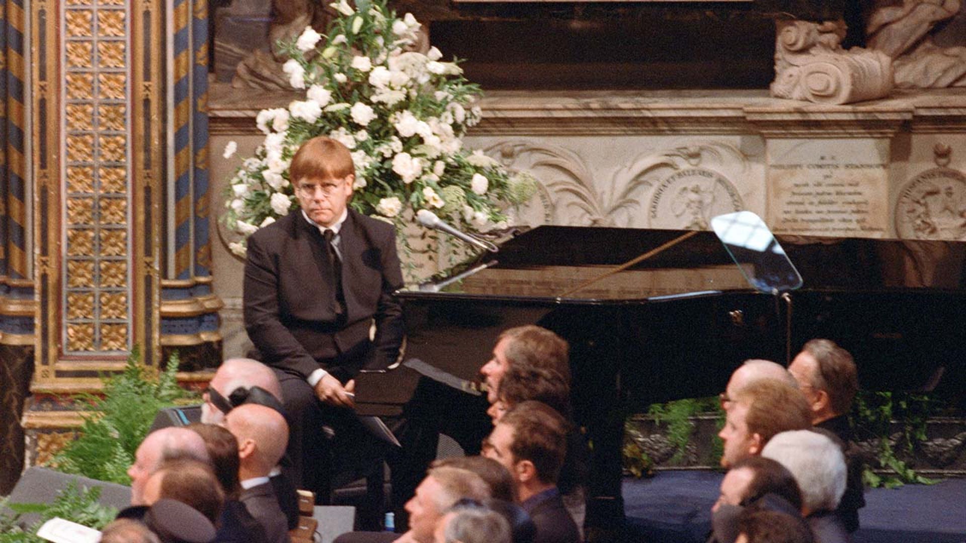 Elton John performs on stage at Princess Diana's funeral