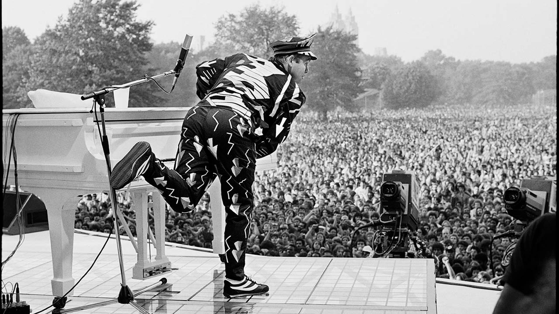 Elton John performs on stage