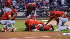 Angels' Chase Silseth gets nailed in the back of the head by teammate's errant throw