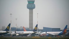 Video captures moment armed police escort man from plane due to 'explosive device' threat