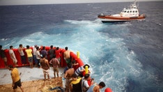Two dead as Italian crews rescue dozens of migrants from multiple shipwrecks off country's southern coast