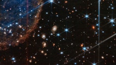 Webb Space Telescope captures mysterious 'question mark' in shot of forming stars