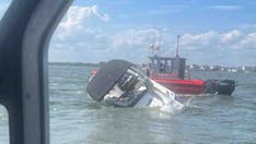Coast Guard saves 4 people, dog from sinking boat moments before it capsizes