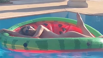 Elizabeth Hurley heats up summer by lounging nude on pool float, reuniting with Joan Collins, Elton John