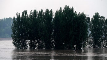 Flash flooding causes Chinese bridge to collapse, 2 cars fall into river below