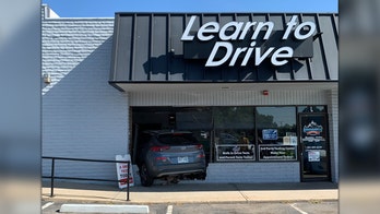 Employee at Colorado driving school plows through front of business' building