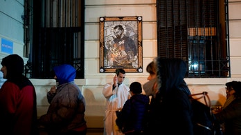 Argentines ask patron saint of work for jobs as economy tanks, elections loom