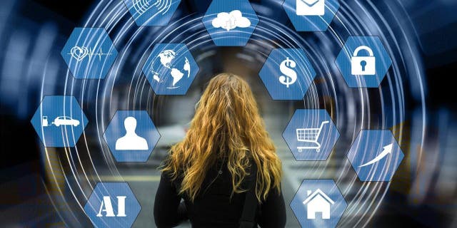 Stock image shows woman and tech icons