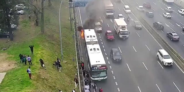 Passengers fleeing bus