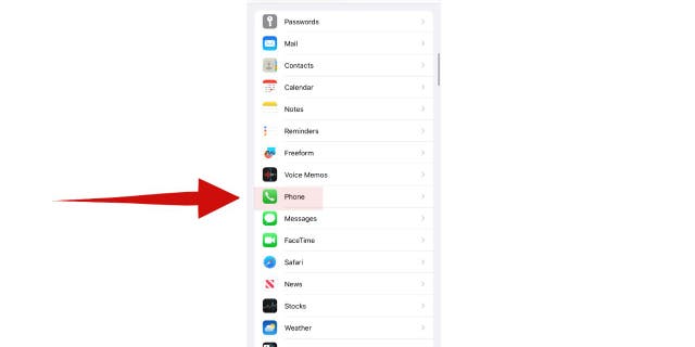 Screenshot of red arrow pointing to the "Phone" option in Settings on an iPhone