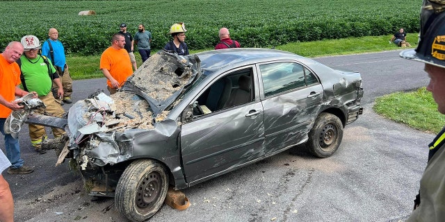 Damaged car after crashing into home