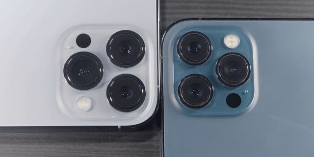 White iPhone cameras and blue iPhone cameras up close