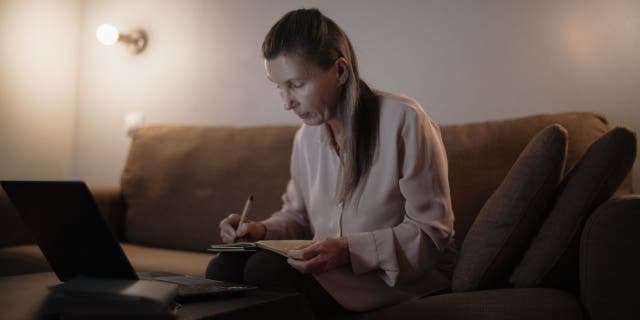 Woman doing her research on what scams to look out for.