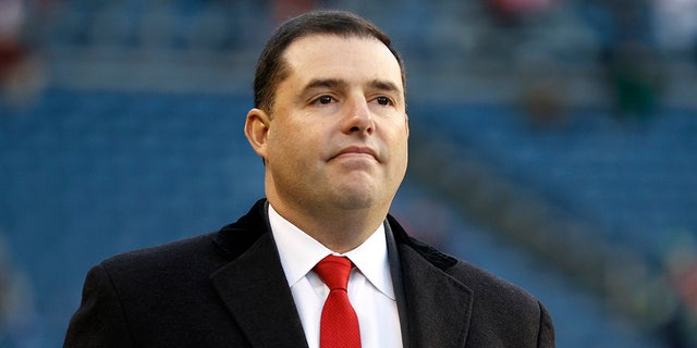 Jed York on the football field before a game