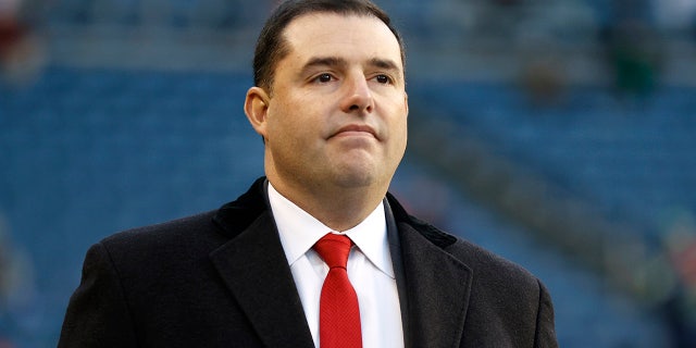 Jed York on the football field before a game