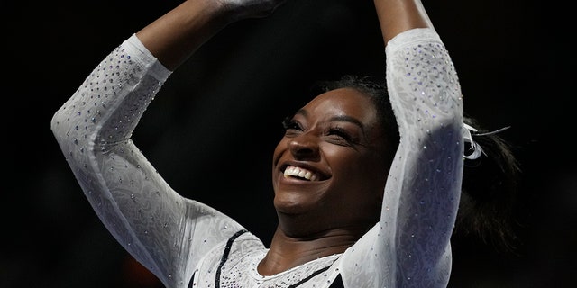 Simone Biles smiles after the win
