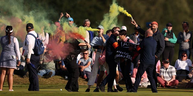 Protesters disrupt the final round of the AIG Women's Open