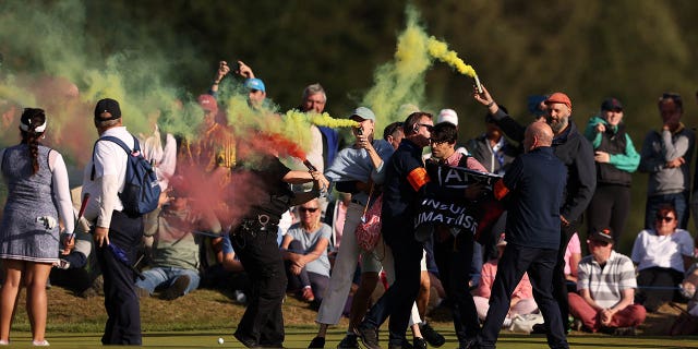 Protesters disrupt the final round of the AIG Women's Open