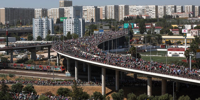 People standing on a bridge