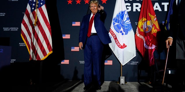 Trump points to a supporter at New Hampshire event
