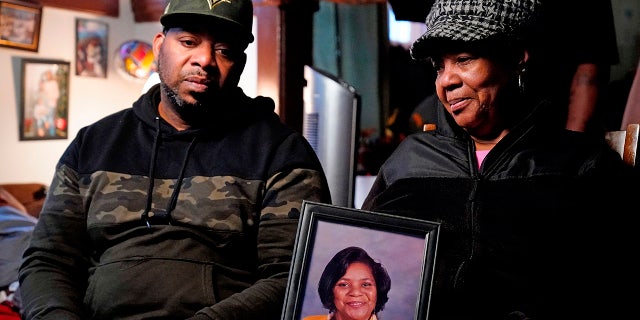 Tops supermarket shooting victim's photo held by family members