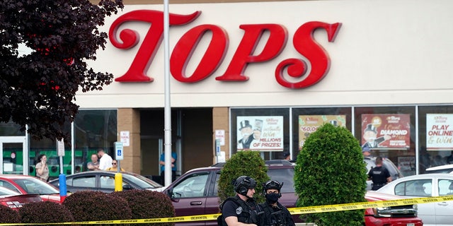 Tops supermarket shooting scene with armed police outside