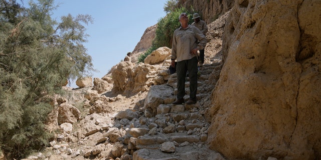 A photo of rocks, a trail
