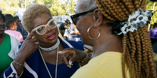 City Councilwoman Ju'Coby Pittman speaks with supporters at Jacksonville vigil