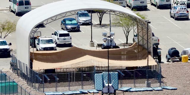 A large arched canopy with a lower canopy below it