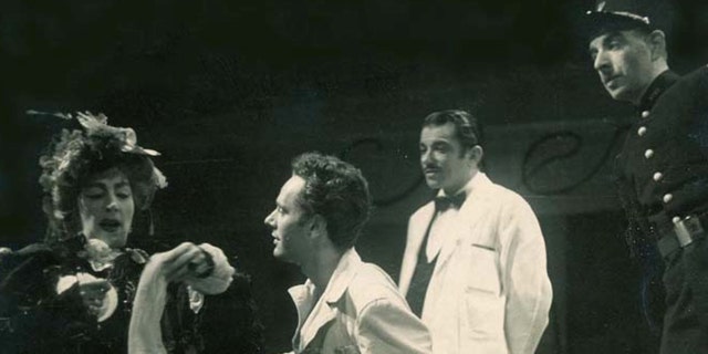 A young Alan Shayne performing on stage with an actor and actress wearing a white shirt