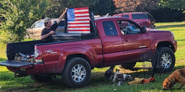 flag displayed in bed of pickup