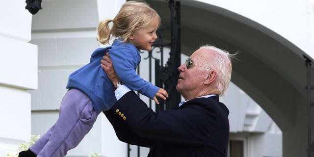 Biden with a grandchild
