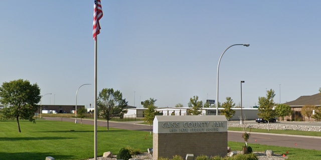 Google Maps screenshot of Cass County Jail sign, American flag