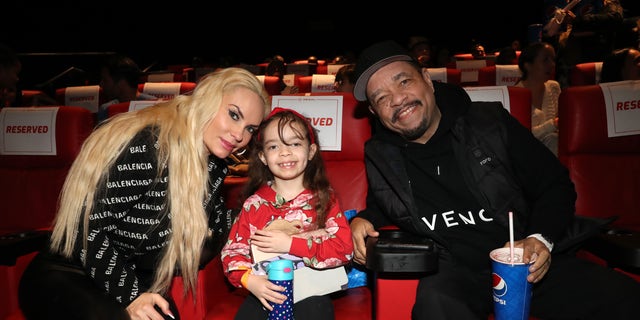 Coco Austin, Chanel, and Ice T sit in a movie theater together